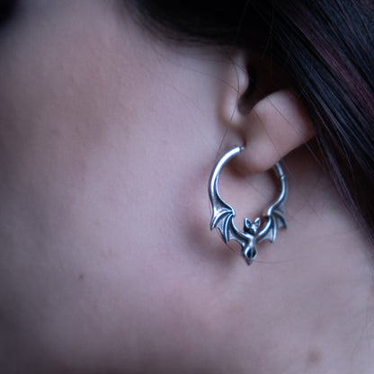 Silver Gothic Bat hoop earring worn in a stretched earlobe