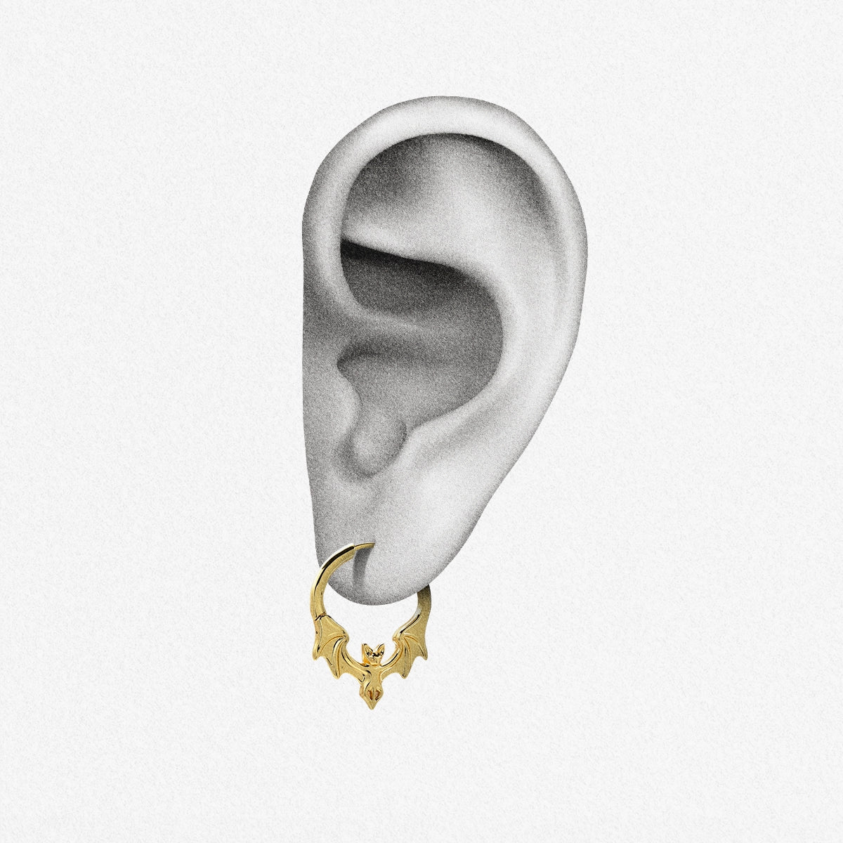 Gold Gothic Bat hoop earring shown on an ear illustration