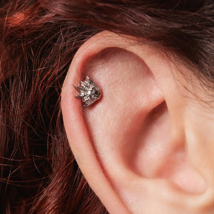 Gothic conch ear stud in silver titanium worn as a helix cartilage piercing on model