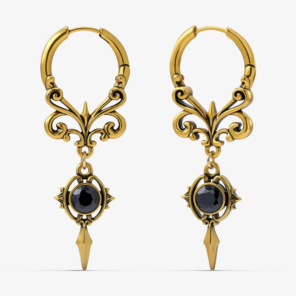 Pair of gold-tone Gothic Crest hoop earrings with scrolling filigree, black oval stones, and pointed drops