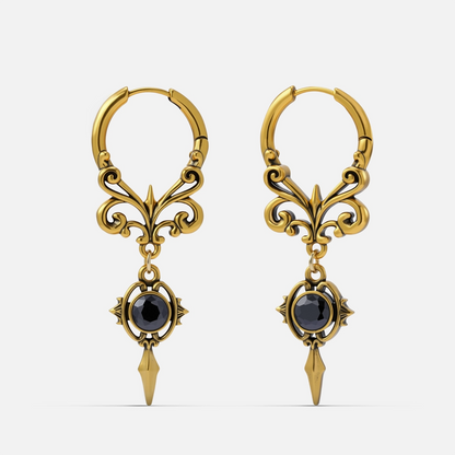 Pair of gold-tone Gothic Crest hoop earrings with scrolling filigree, black oval stones, and pointed drops