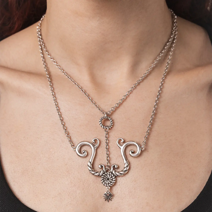 Gothic layered style tideworn knot necklace in silver worn on model neck