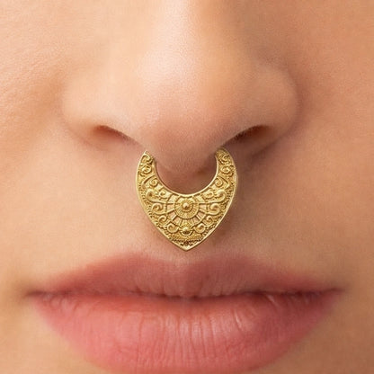 Gold-tone Gothic Mandala Clicker worn as a septum ring, showing its detailed vintage-inspired pattern.