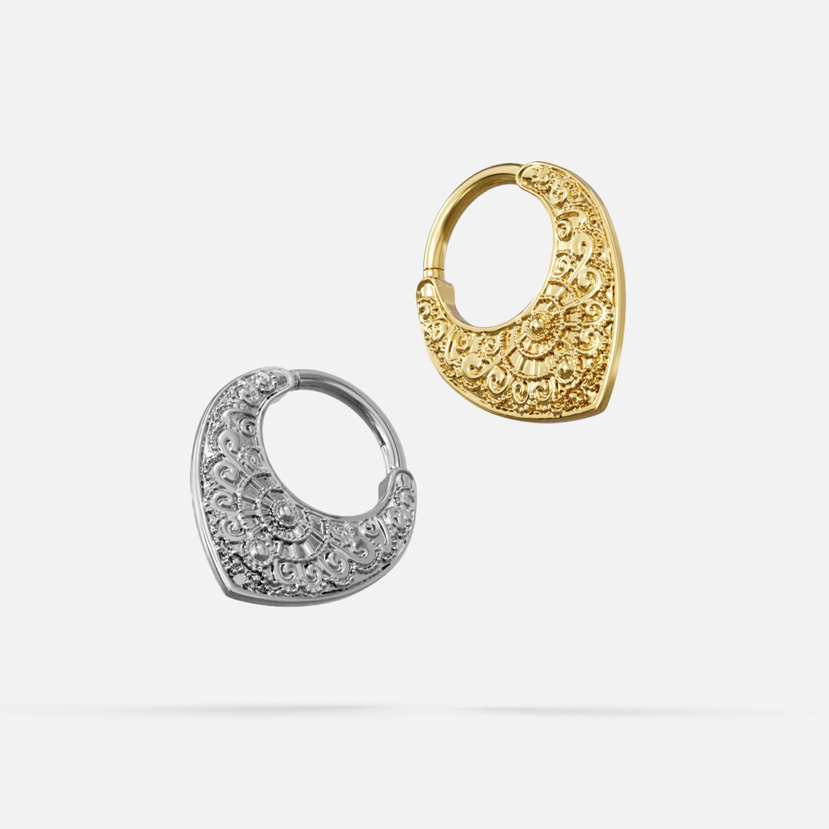Silver- and gold-tone Gothic Mandala Clickers displayed together from angled views on a light gray background.