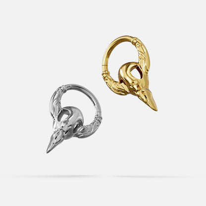 Silver- and gold-tone Gothic Raven Clickers displayed together from angled views on a light gray background.
