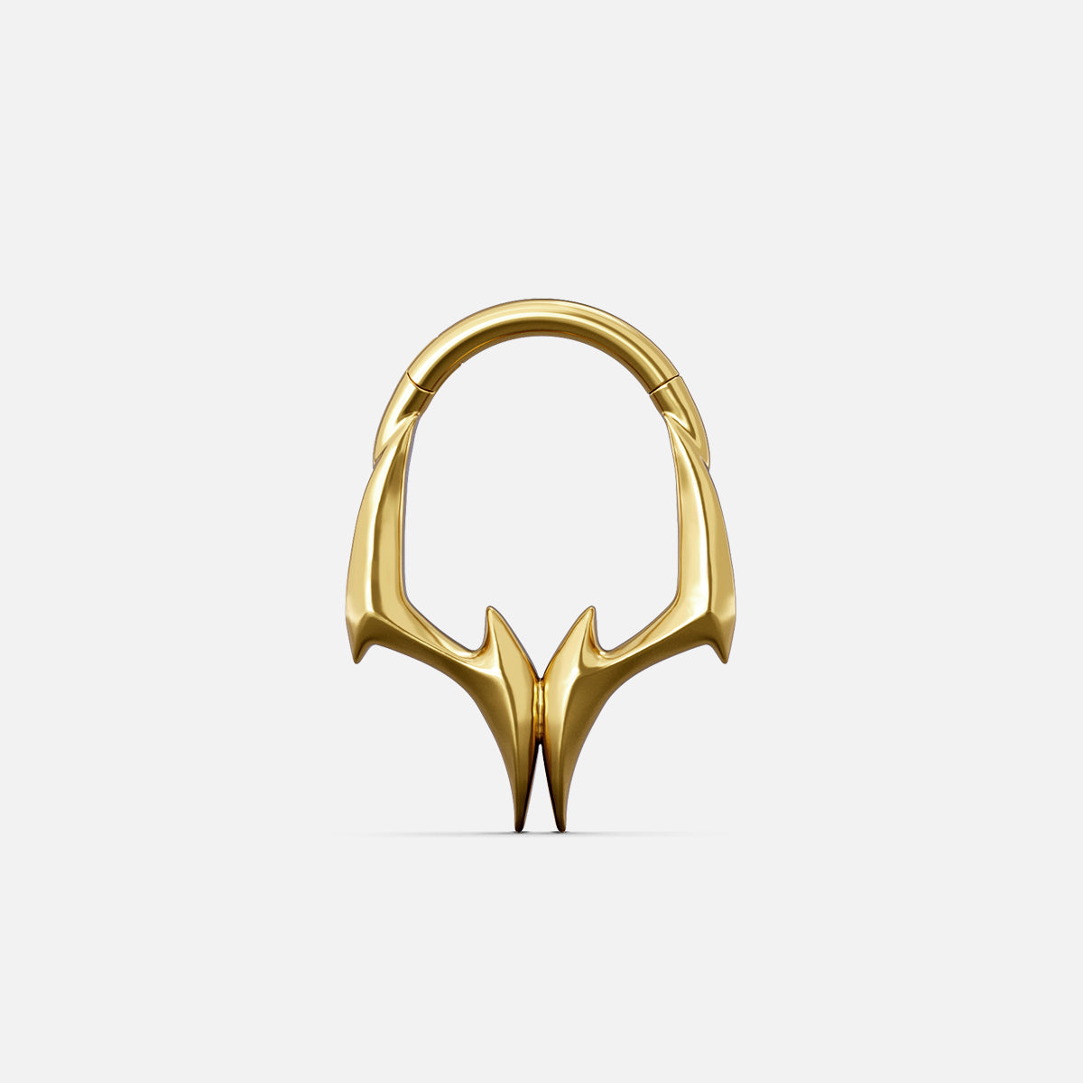 Gold-tone Gothic Talon Clicker with symmetrical claw-like points and a sharp angular profile.