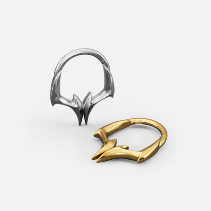 Silver- and gold-tone Gothic Talon Clickers shown from multiple angles to display the ring shape and angular talon details.