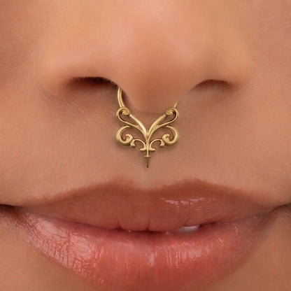 Gold-tone Gothic Vine Clicker worn as a septum ring, showing its decorative vintage-inspired design.