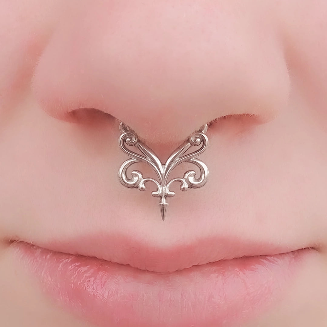 Silver-tone Gothic Vine Clicker worn as a septum ring, featuring delicate symmetrical scrollwork.