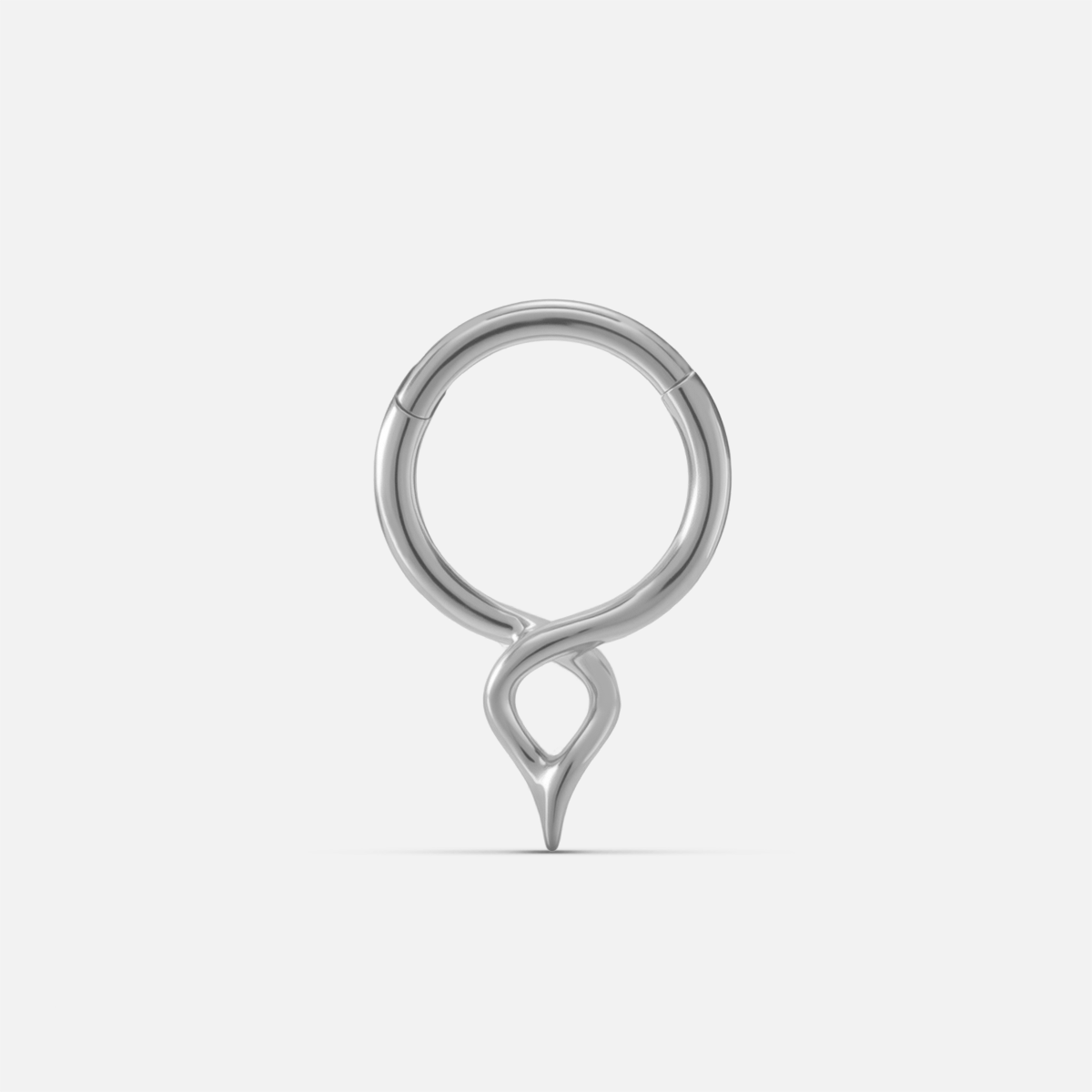 Silver-tone twist clicker ring with a small teardrop drop, shown front facing on a plain background