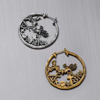 Silver and gold Graveyard Bat hoop earrings shown together
