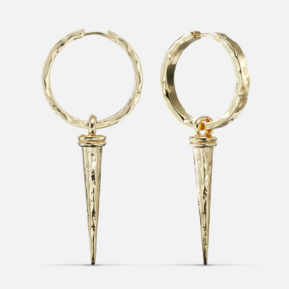 Pair of gold-tone hammered hoop earrings with tapered spike drops on a white background