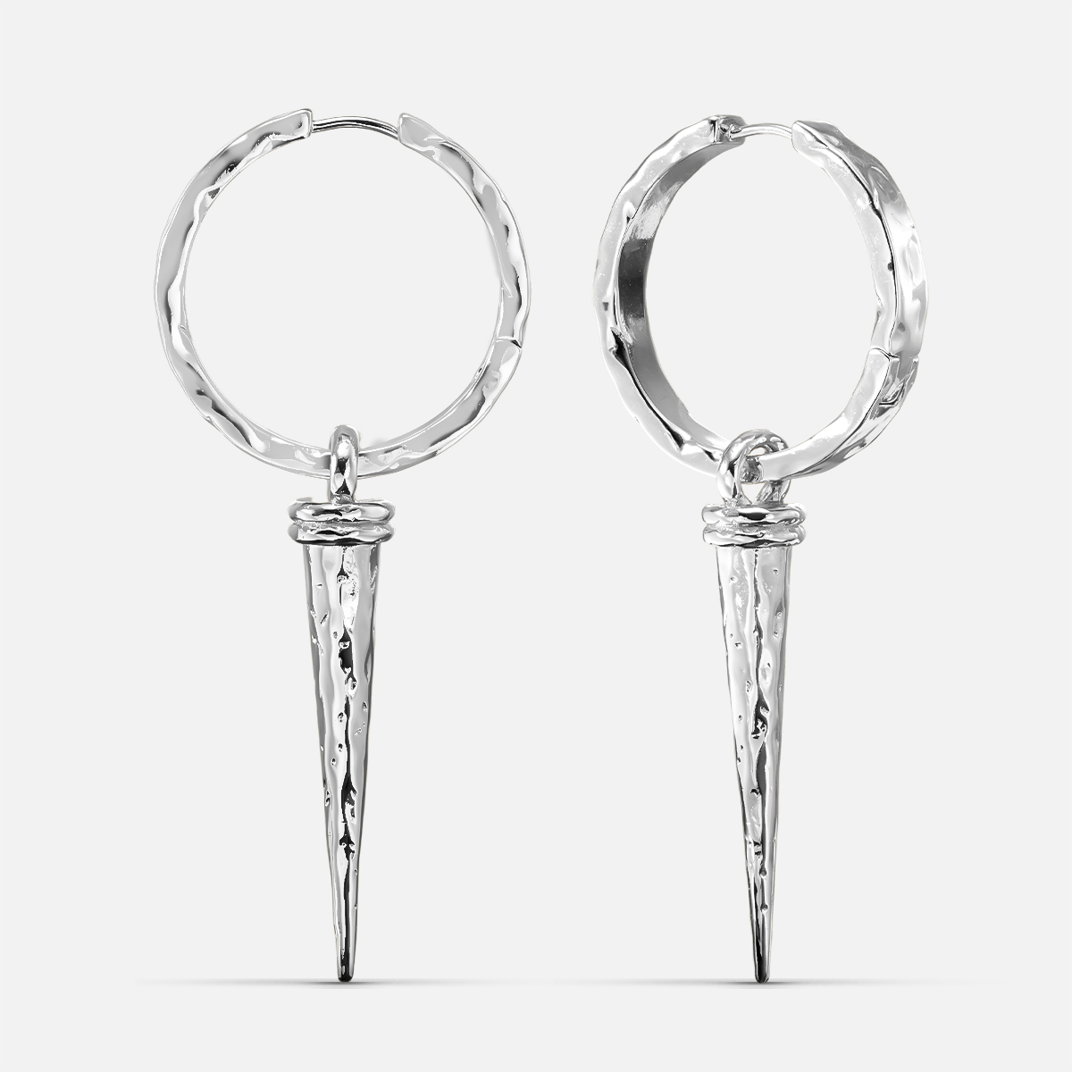 Pair of silver-tone hammered hoop earrings with tapered spike drops on a white background