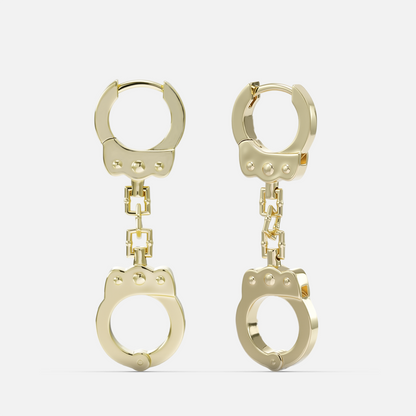 Gold-tone huggie earrings with a chain link connecting to a handcuff-shaped charm, front view