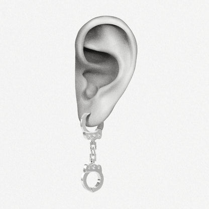 Illustrated ear wearing a silver-tone handcuff chain earring in sketch style