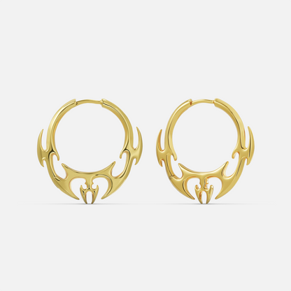 Gold-tone hoop earrings pair featuring a flame or wing motif along the bottom curve, front view