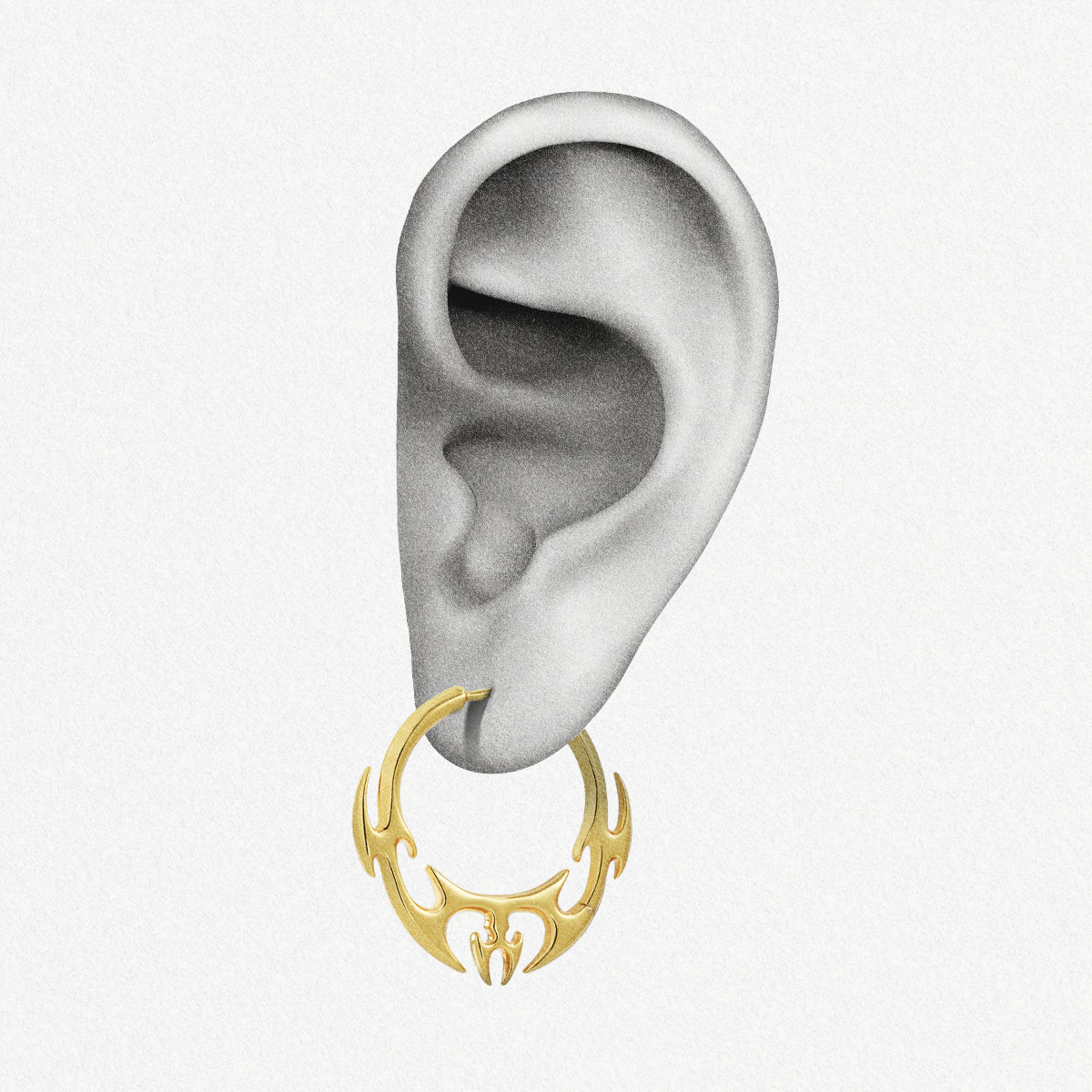 Gold Hellfire Wing hoop earring shown on an ear illustration