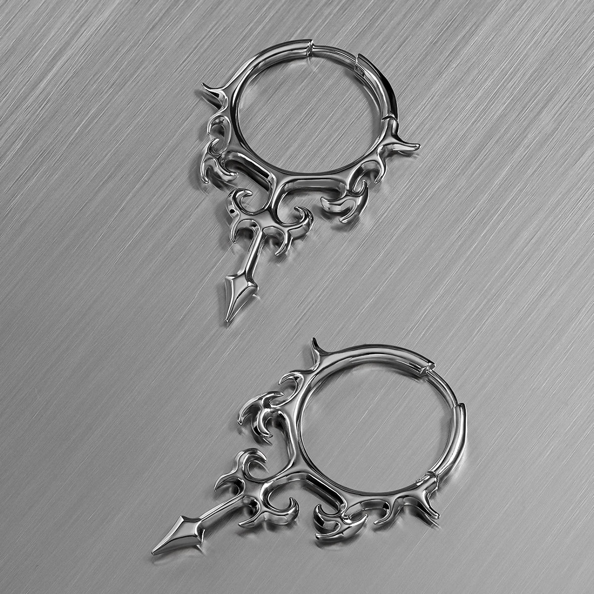 Pair of silver Hellflame Blade hoop earrings shown open and closed