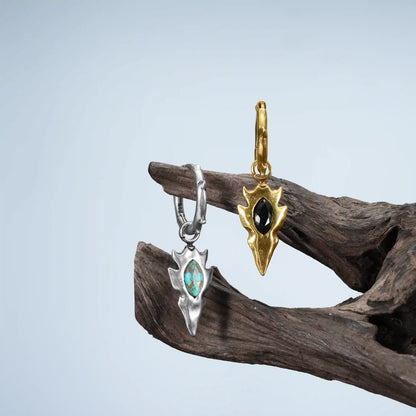 Knapped Stone Earrings in silver and gold displayed on driftwood with turquoise and obsidian stone options