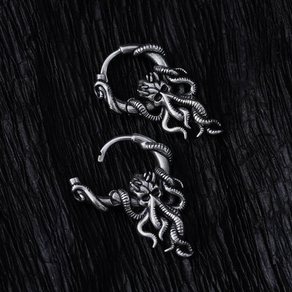 Pair of silver Kraken Mystique hoop earrings with dangling tentacled figures