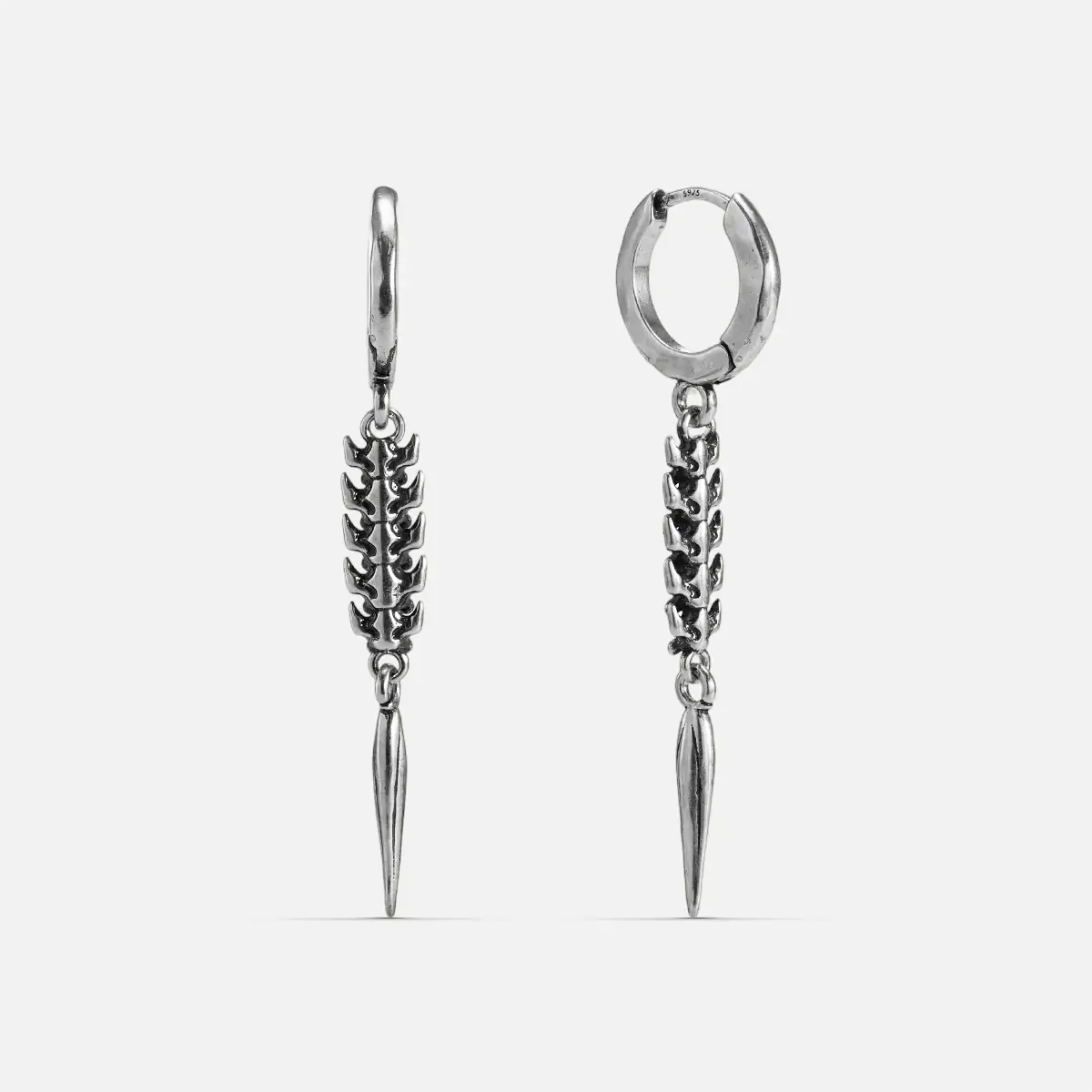 Longinus Abyss Stinger Earrings in 925 sterling silver, pair shown front and back on white, featuring a segmented spine body 