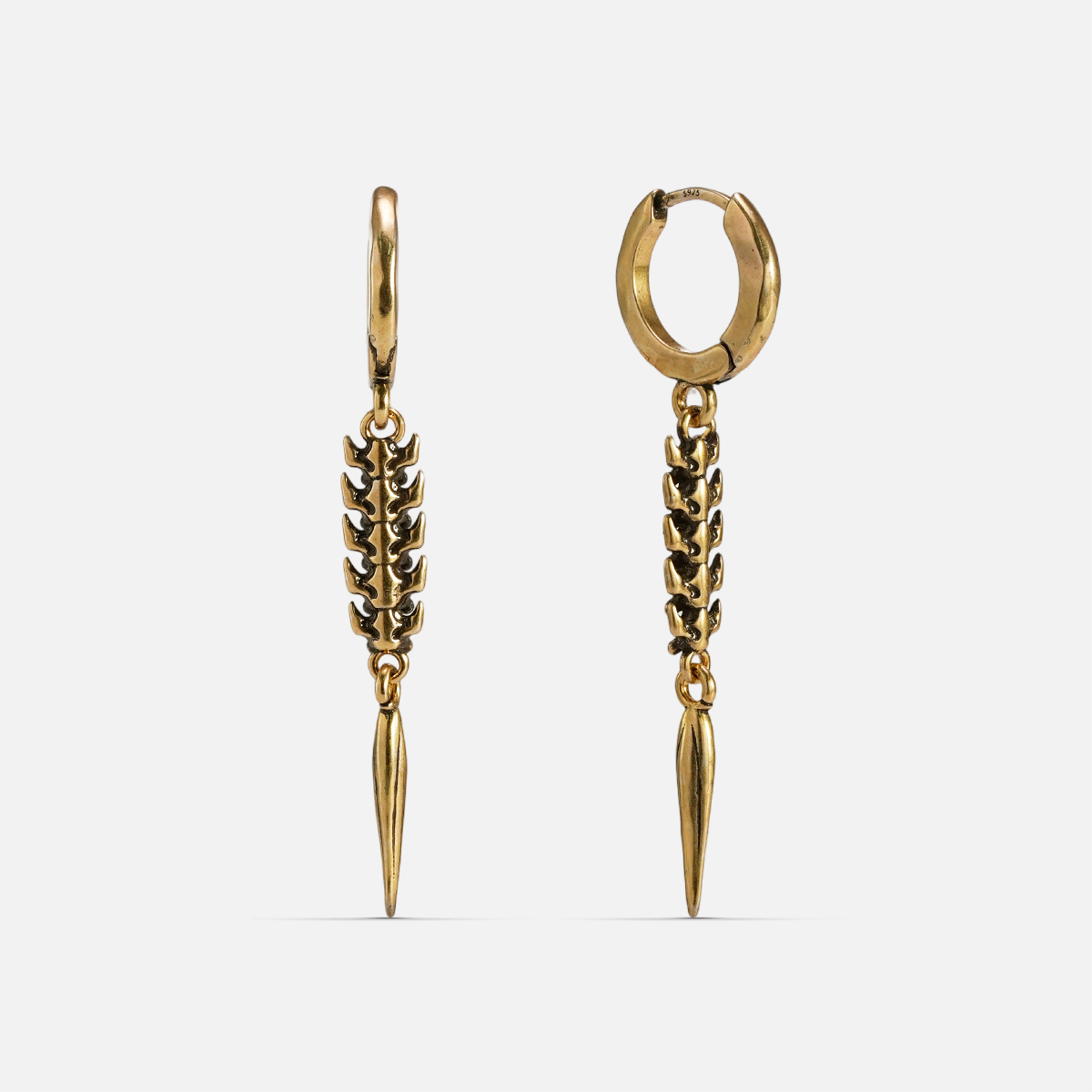 Gold-tone huggie hoop earrings with a segmented spine drop ending in a tapered spike