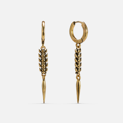 Gold-tone huggie hoop earrings with a segmented spine drop ending in a tapered spike