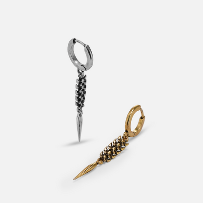 Silver-tone and gold-tone hoop earrings with segmented spine drops laid side by side