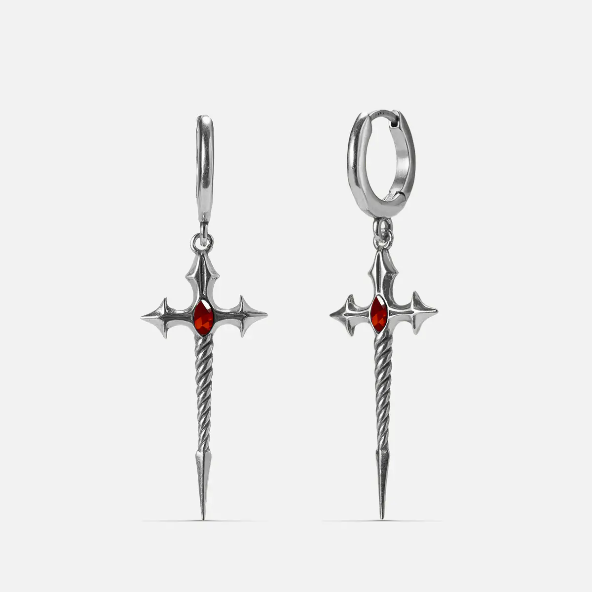 Longinus Godpiercer Earrings in 925 sterling silver, pair shown front and back on white, featuring red stone centers and twis