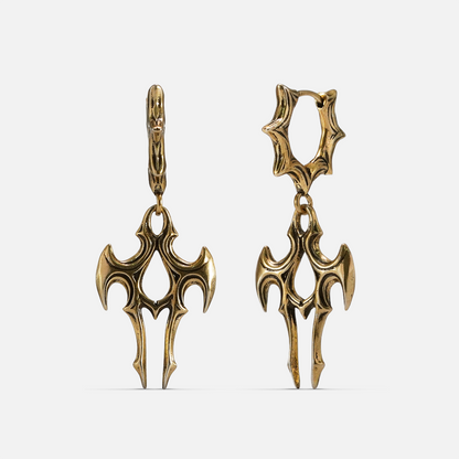 Pair of gold-tone talon shaped drop earrings with spiked hoop closures, displayed on a plain background