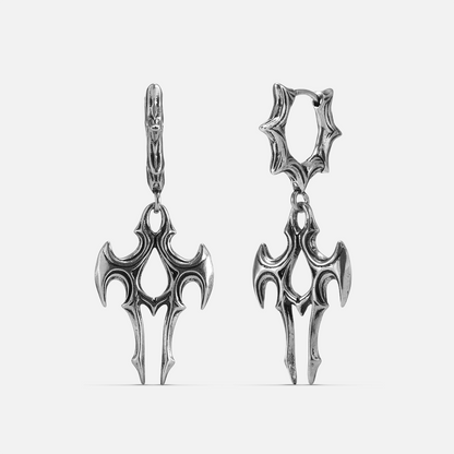 Pair of silver-tone talon shaped drop earrings with spiked hoop closures, shown against a plain background