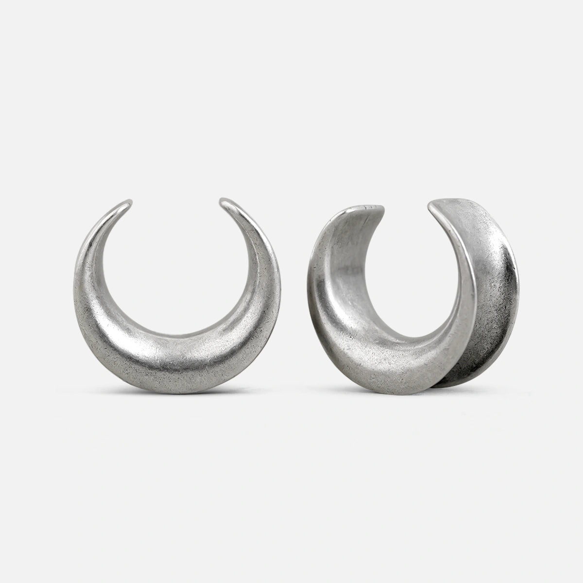 Pair of silver Lunar Eclipse tunnels with crescent-shaped openings