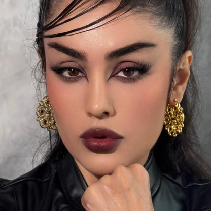 Gold Mandala Bloom Earrings styled on model with floral mandala shape, zircon details, and elegant gothic jewelry look