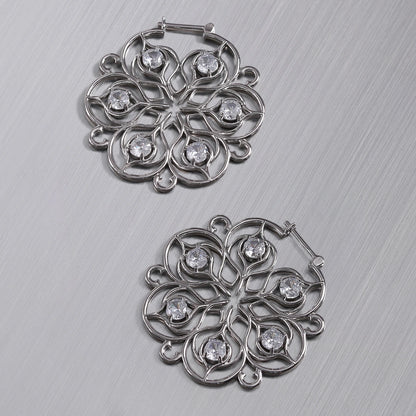 Pair of silver Mandala Bloom hoop earrings with clear center accents