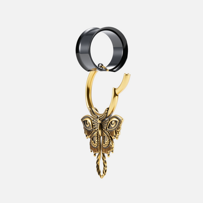 Black modular ring tunnel paired with a gold-tone hoop featuring a detailed butterfly charm