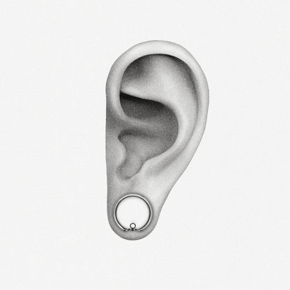 Silver-tone modular ring tunnel positioned in an illustrated earlobe to show the worn fit