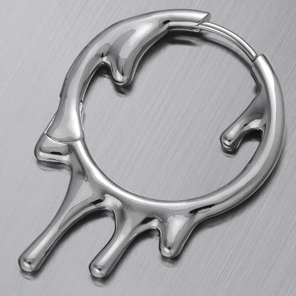 Molten Drop Earrings in 925 sterling silver, single hoop shown in a close product detail on a brushed metal surface.