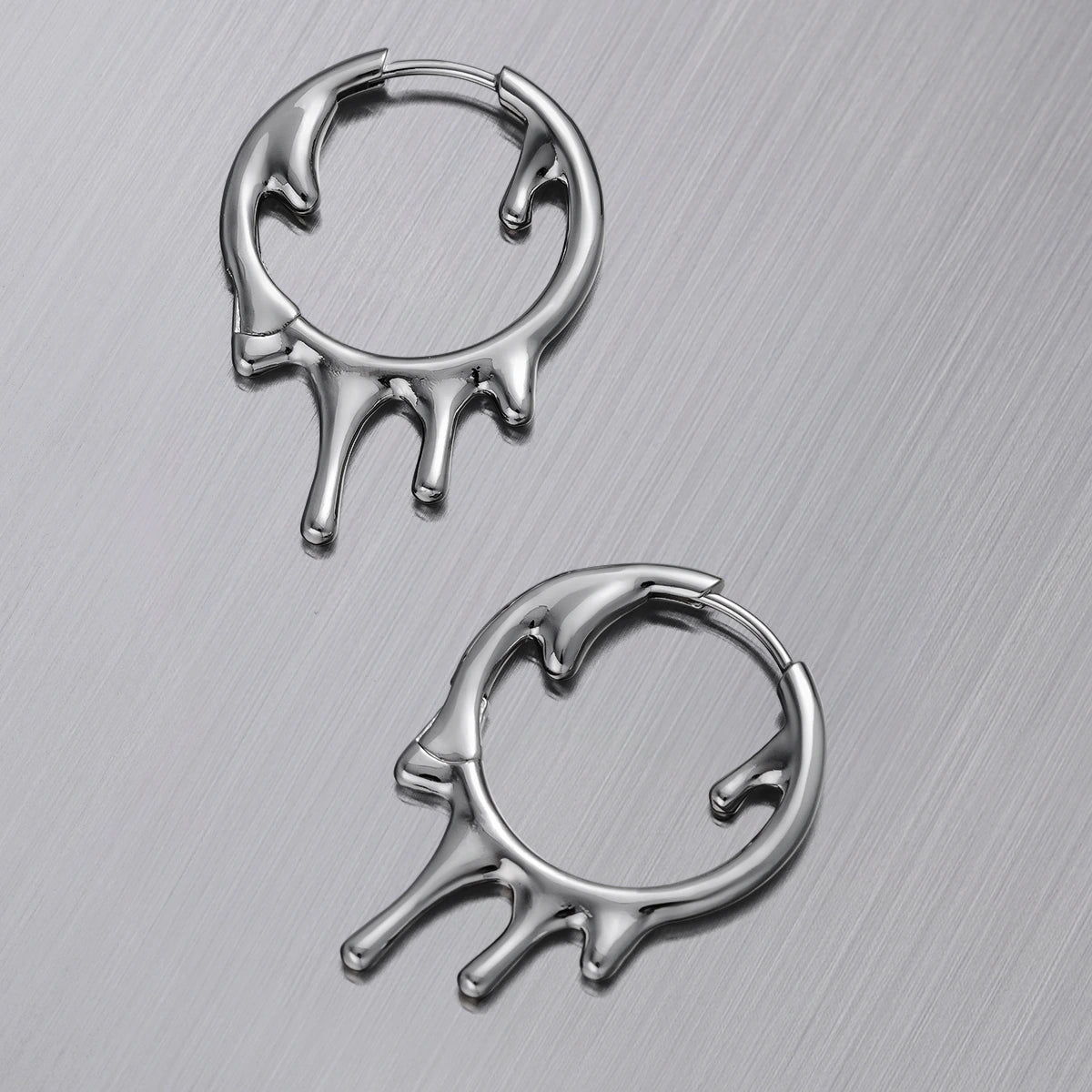 Pair of silver Molten Drop hoop earrings with dripping lower edges