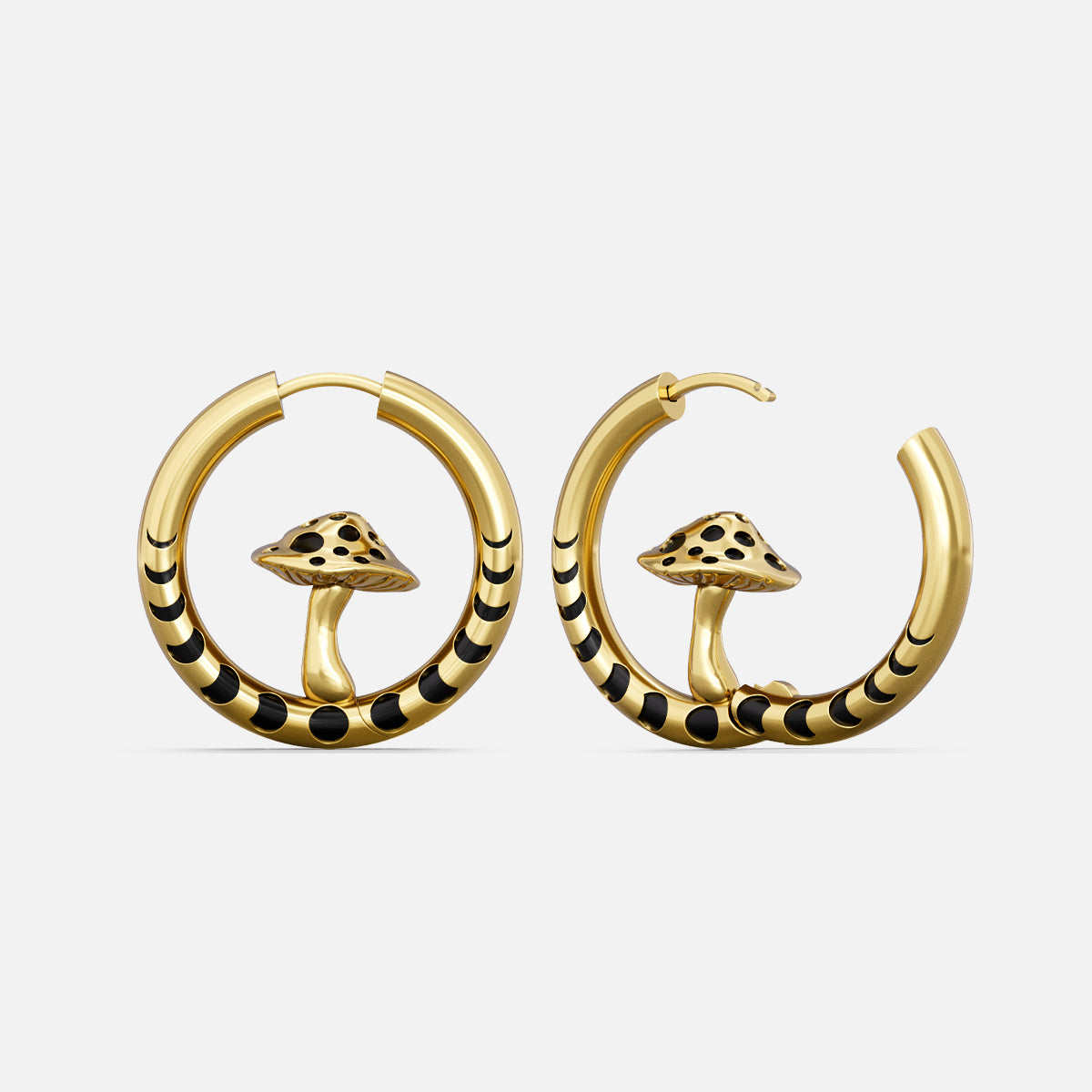 Gold-tone hoop earrings with black striped bands and a mushroom charm inside each hoop