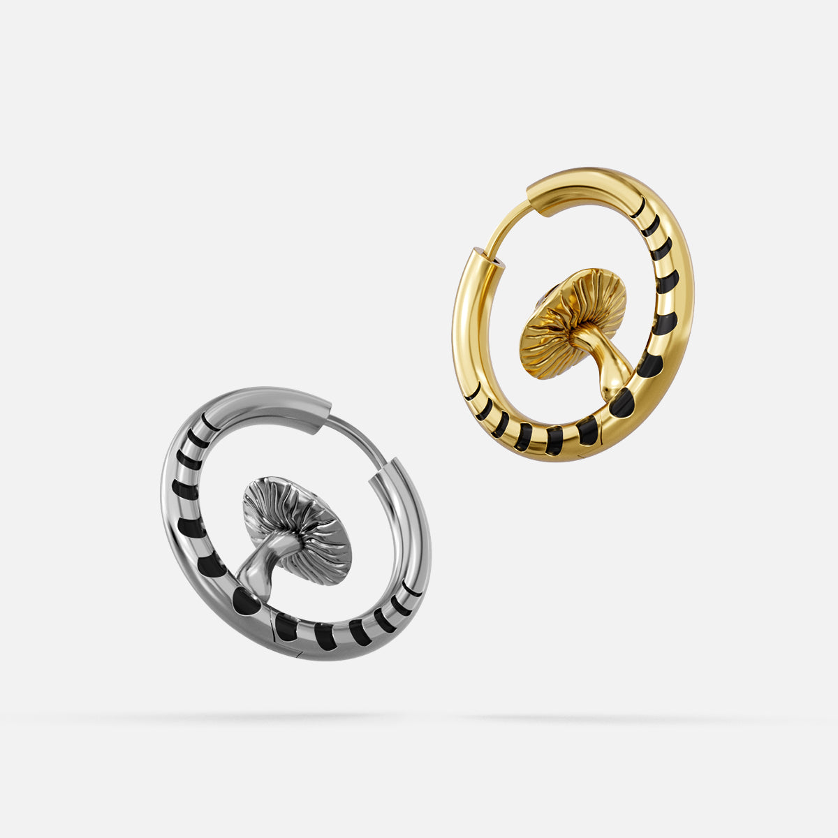 Silver and gold Mystic Fungi hoop earrings with striped bands and mushroom motifs