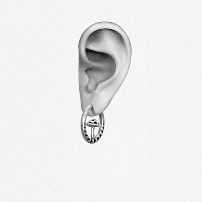 Silver Mystic Fungi hoop earring shown on an ear illustration