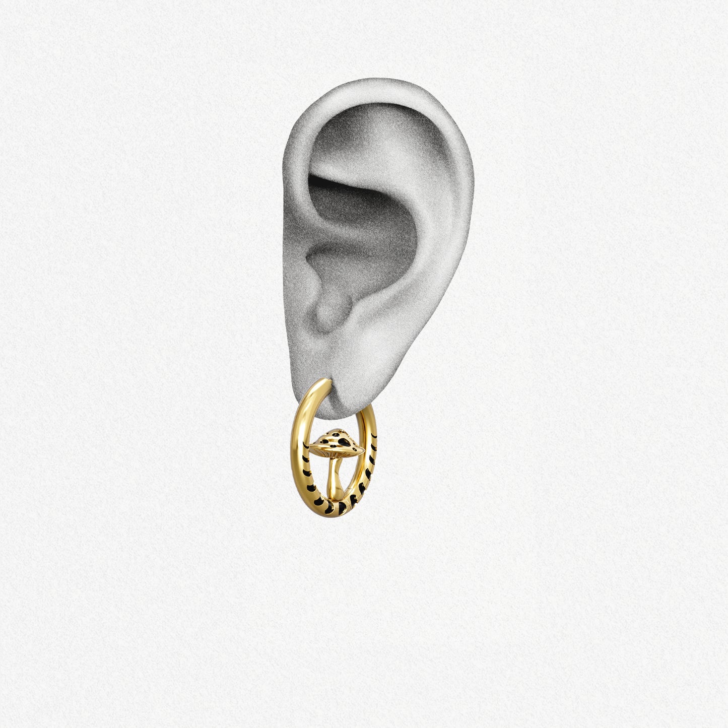 Gold Mystic Fungi hoop earring shown on an ear illustration