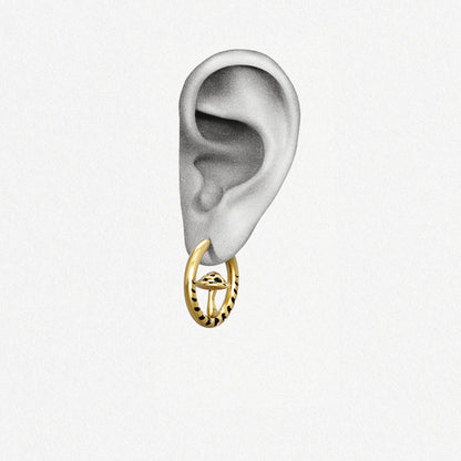 Gold Mystic Fungi hoop earring shown on an ear illustration