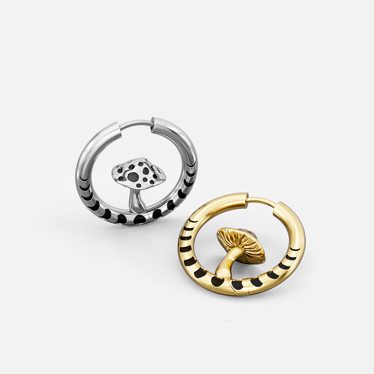 Silver and gold Mystic Fungi hoop earrings shown open and lying flat