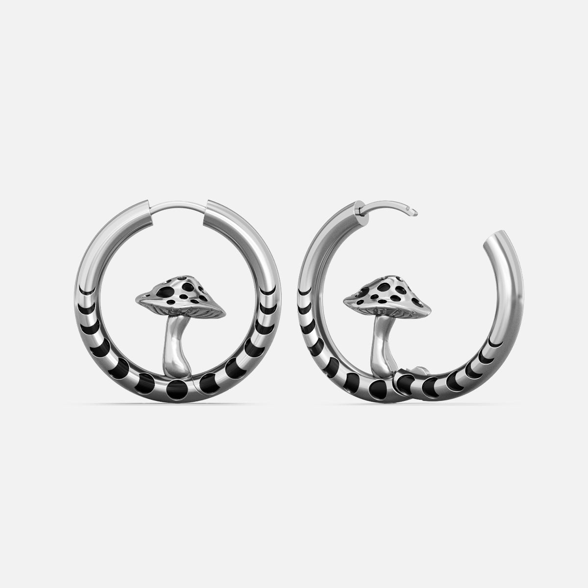 Silver-tone hoop earrings with striped bands and a mushroom charm centered in each hoop, front view