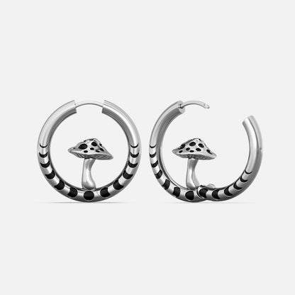 Silver-tone hoop earrings with striped bands and a mushroom charm centered in each hoop, front view