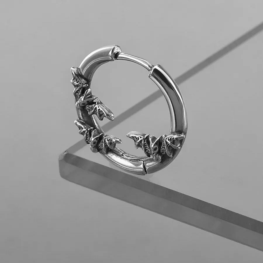 Side view of silver Mystic Insight hoop earring with raised bat details