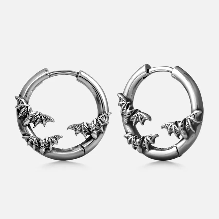 Silver-tone hoop earrings with bats forming a crescent moon shape, shown as a pair
