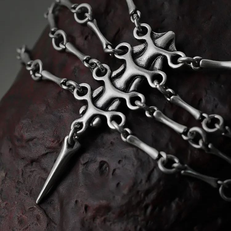 Close-up of Mystic Spine necklace with vertebrae pendant and pointed lower drop