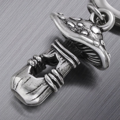 Close-up of silver Mystical Mushroom earring with textured cap and stem details